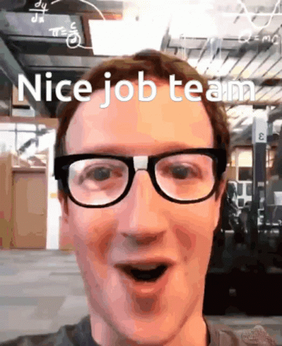 A Man Wearing Glasses Says " Nice Job Team " In Front Of A Building GIF
