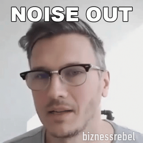 A Man Wearing Glasses Says Noise Out On The Bottom GIF