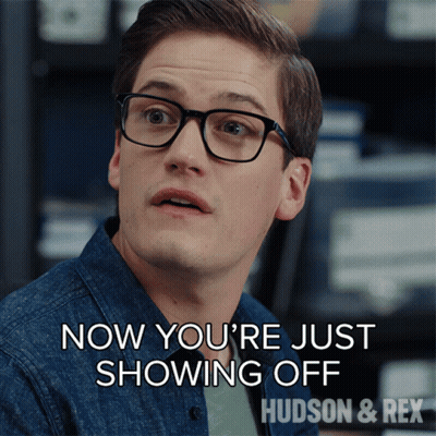 A Man Wearing Glasses Says " Now You 'Re Just Showing Off Hudson & Rex " GIF