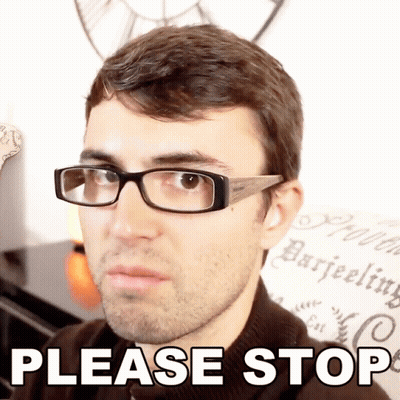 A Man Wearing Glasses Says Please Stop In Front Of A Wall With A Clock GIF