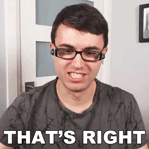 A Man Wearing Glasses Says That 'S Right In Front Of A White Door GIF