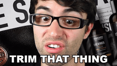 A Man Wearing Glasses Says Trim That Thing In Front Of A Manscaped Product GIF