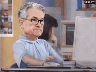 A Man Wearing Glasses Sits In Front Of A Computer With Rd Btc Written On The Bottom GIF