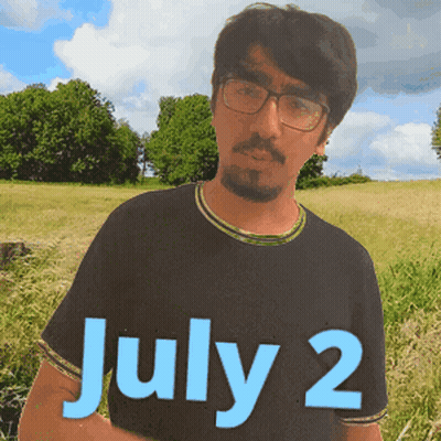 A Man Wearing Glasses Stands In A Field With The Date July 2 GIF