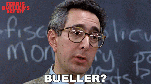A Man Wearing Glasses Stands In Front Of A Blackboard With The Word Bueller On It GIF