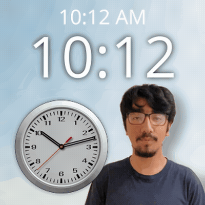 A Man Wearing Glasses Stands In Front Of A Clock That Says 10:12 Am GIF