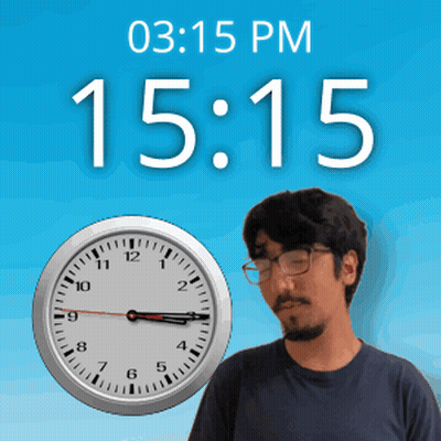 A Man Wearing Glasses Stands In Front Of A Clock That Says 15:15 GIF