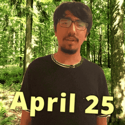 A Man Wearing Glasses Stands In Front Of A Forest With The Date April 25 GIF