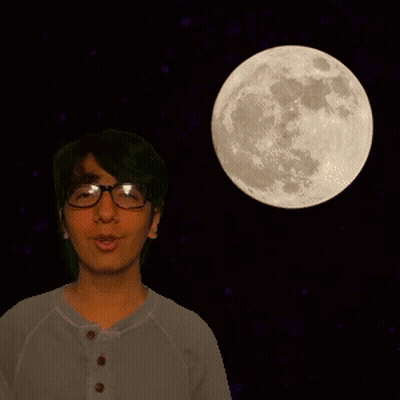 A Man Wearing Glasses Stands In Front Of A Full Moon In The Night Sky GIF