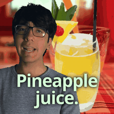 A Man Wearing Glasses Stands In Front Of A Pineapple Juice GIF