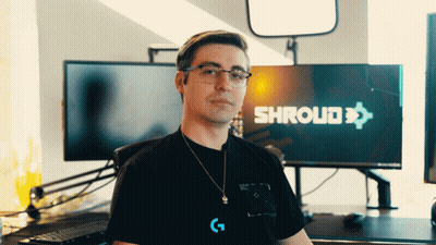 A Man Wearing Glasses Stands In Front Of A Screen That Says Shroud GIF