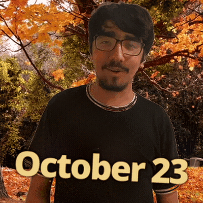 A Man Wearing Glasses Stands In Front Of Trees With The Date October 23 GIF