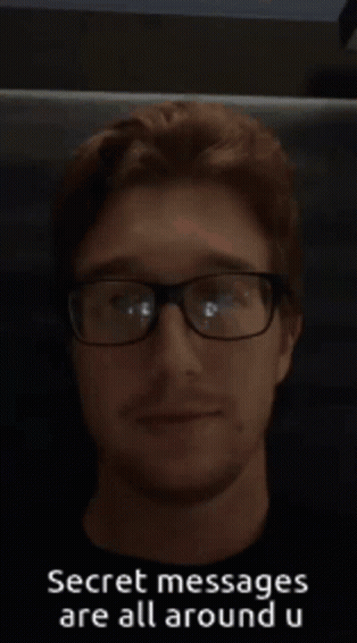 A Man Wearing Glasses With The Words Secret Messages Are All Around U On The Bottom GIF
