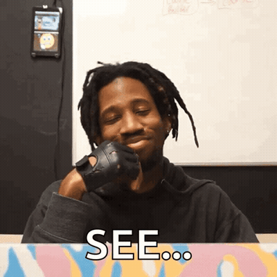 A Man Wearing Gloves Is Smiling And Says See On The Bottom GIF