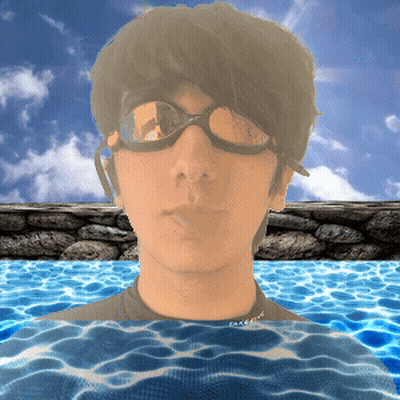 A Man Wearing Goggles Is Swimming In A Pool With The Word Face On His Shirt GIF