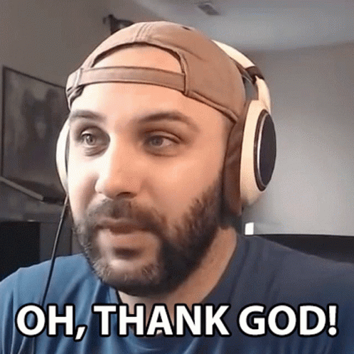 A Man Wearing Headphones And A Baseball Cap Says Oh Thank God GIF
