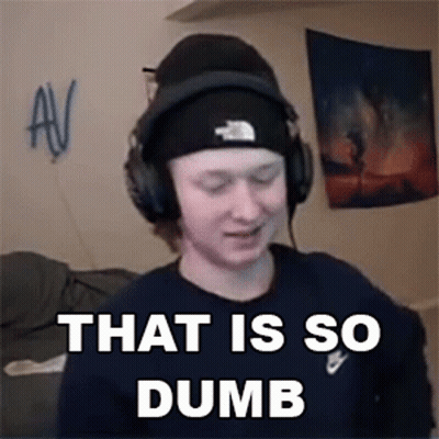 A Man Wearing Headphones And A Beanie Is Making A Funny Face . GIF