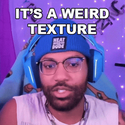 A Man Wearing Headphones And A Beanie Is Making A Funny Face While Talking On A Video Call . GIF