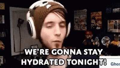 A Man Wearing Headphones And A Beanie Is Saying `` We 'Re Gonna Stay Hydrated Tonight ! '' GIF