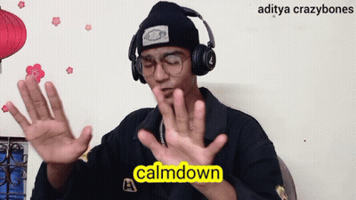 A Man Wearing Headphones And A Beanie Says Calmdown In Yellow Letters GIF