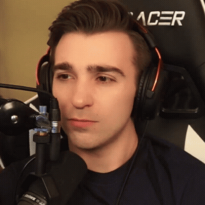 A Man Wearing Headphones And A Black Acer Chair GIF