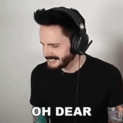 A Man Wearing Headphones And A Black Shirt Says Oh Dear . GIF
