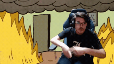 A Man Wearing Headphones And A Black Shirt With The Number 70 On It Is Sitting In Front Of A Fire GIF