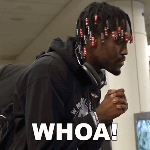 A Man Wearing Headphones And A Black Shirt With The Word Whoa On It GIF