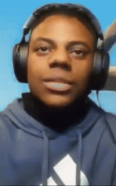 A Man Wearing Headphones And A Blue Adidas Hoodie GIF