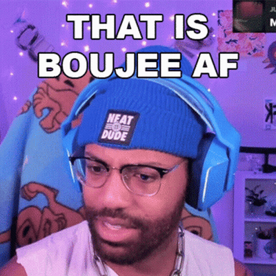 A Man Wearing Headphones And A Blue Beanie That Says Neat Dude GIF