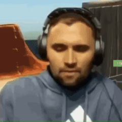A Man Wearing Headphones And A Blue Hoodie With An Adidas Logo GIF