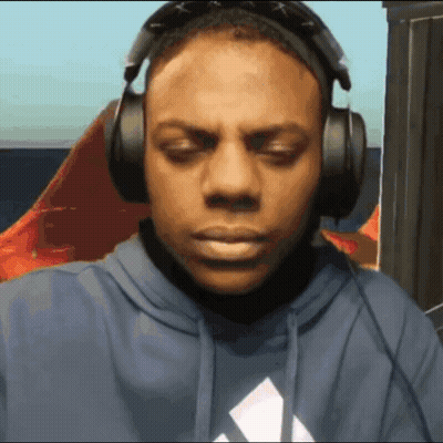 A Man Wearing Headphones And A Blue Hoodie With An Adidas Logo On It GIF