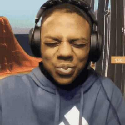 A Man Wearing Headphones And A Blue Hoodie With The Number 130 On It GIF