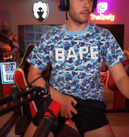 A Man Wearing Headphones And A Blue Shirt That Says Bape GIF