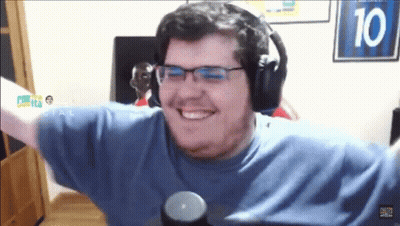 A Man Wearing Headphones And A Blue Shirt With The Number 10 Behind Him GIF