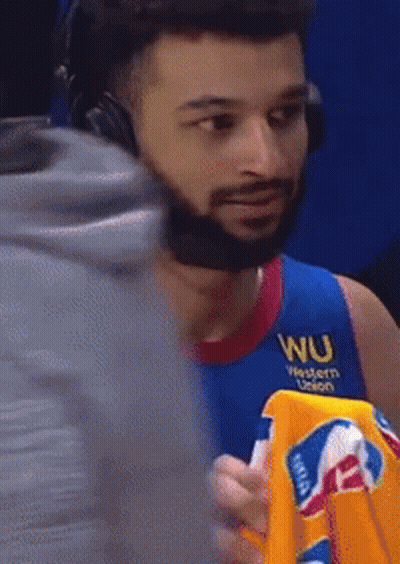 A Man Wearing Headphones And A Blue Shirt With Wu Western Union On It GIF