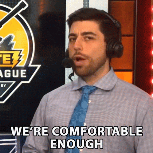 A Man Wearing Headphones And A Blue Tie Says We 'Re Comfortable Enough GIF
