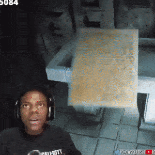 A Man Wearing Headphones And A Call Of Duty Shirt Looks Surprised GIF
