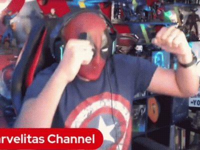 A Man Wearing Headphones And A Captain America Shirt Is Dancing In Front Of A Marvelitas Channel Sign GIF