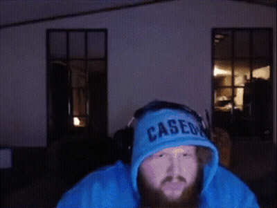 A Man Wearing Headphones And A Cased Hoodie GIF