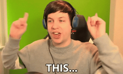 A Man Wearing Headphones And A Grey Sweater Says " This " GIF
