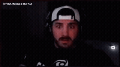 A Man Wearing Headphones And A Hat Is Saying `` I Dunno Fam '' In Front Of A Microphone . GIF