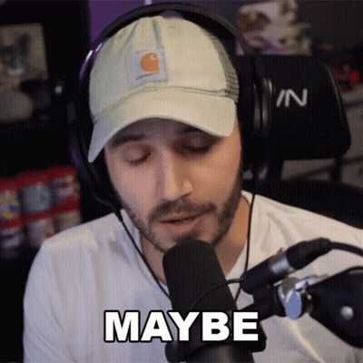 A Man Wearing Headphones And A Hat Says " Maybe " In Front Of A Microphone GIF