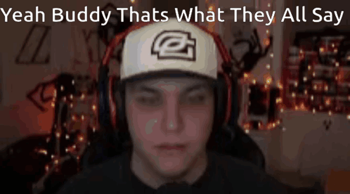 A Man Wearing Headphones And A Hat Says Yeah Buddy That 'S What They All Say . GIF