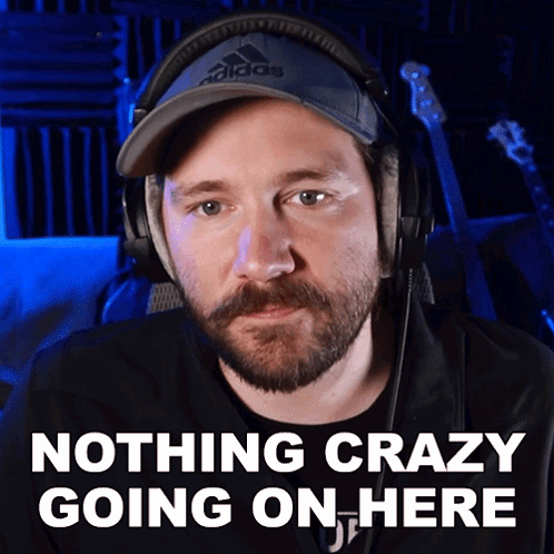 A Man Wearing Headphones And A Hat That Says Adidas GIF
