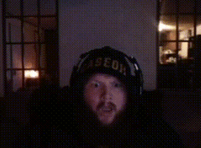 A Man Wearing Headphones And A Hat That Says " Aeon " GIF