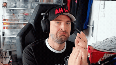A Man Wearing Headphones And A Hat That Says Ah10 On It GIF