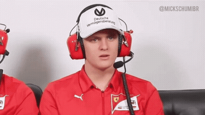 A Man Wearing Headphones And A Hat That Says Deutsche Vermögensberatung On It GIF