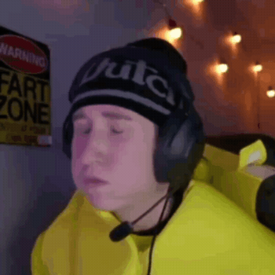 A Man Wearing Headphones And A Hat That Says Fruitca On It GIF