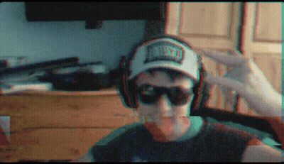 A Man Wearing Headphones And A Hat That Says Miami GIF